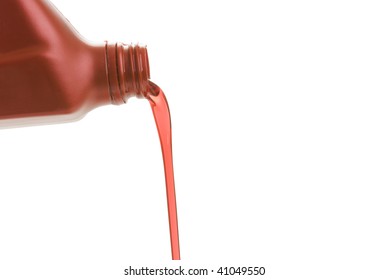 Transmission Fluid Pouring Out Of A Bottle On A White Background