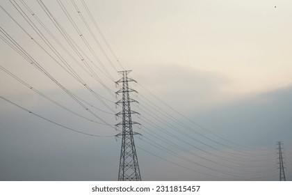 transmission tower, high voltage, high voltage electricity, power grid - Shutterstock ID 2311815457
