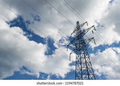 Transmission tower of high voltage overhead power lines, symbol of electricity, distribution of energy - Shutterstock ID 2194787021