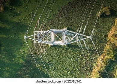 Transmission tower or pylon in top view. That substation, utility, infrastructure or steel structure for network of electrical grids system to carry high-voltage wire, cable or overhead power line. - Shutterstock ID 2022318341
