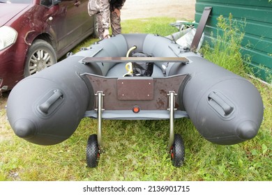 Transom Fheels On Transom Of Gray Inflatable Boat On Car Background