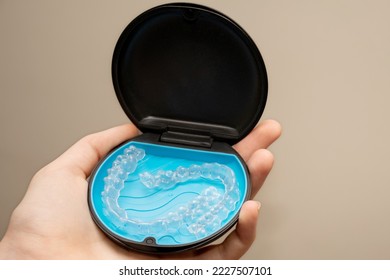 Transparent aligners and storage case box. Invisible braces. Clear teeth straighteners. Plastic bracers