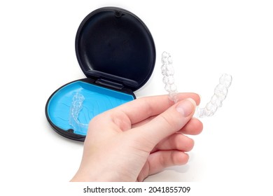 Transparent aligners and storage case. Invisible braces. Clear teeth straighteners. plastic bracers ready to use - Shutterstock ID 2041855709