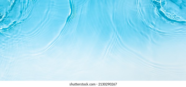 Transparent blue clear water surface texture and ripples  splashes   bubbles  Abstract summer banner background Water waves in sunlight and copy space Cosmetic moisturizer micellar toner emulsion