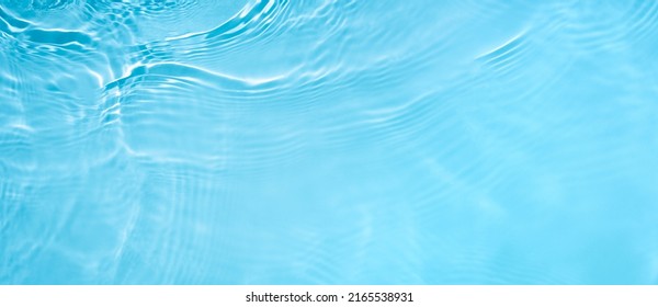 Transparent blue clear water wave surface texture with splashes and bubbles. Abstract summer banner background Water waves in sunlight with copy space Cosmetic moisturizer micellar toner emulsion - Shutterstock ID 2165538931