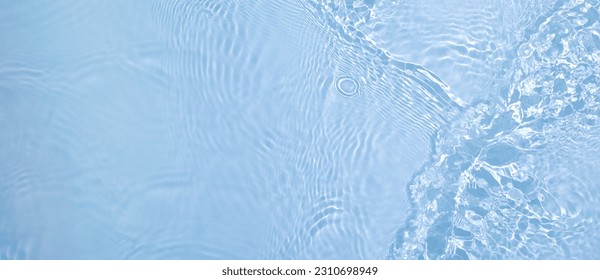 Transparent blue clear water wave surface texture with splashes and bubbles. Abstract summer banner background Water waves in sunlight with copy space Cosmetic moisturizer micellar toner emulsion - Powered by Shutterstock