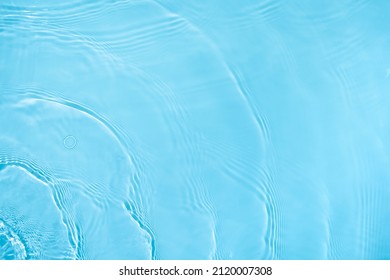 Transparent blue colored clear water surface texture with ripples, splashes and bubbles. Abstract nature background Water waves in sunlight with copy space Cosmetic moisturizer micellar toner emulsion - Shutterstock ID 2120007308
