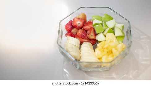 The Transparent Bowl Of Mix Fruit, Pineapple, Apple, Stawberry, Banana Preparing For Made Smoothies Mix Fruit, Good For Health And Diets.