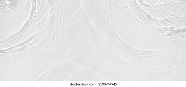 Transparent clear white water surface texture with ripples, splashes and bubbles. Abstract summer banner background Water waves in sunlight with copy space Cosmetic moisturizer micellar toner emulsion - Shutterstock ID 2138944945