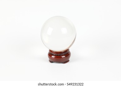 Transparent Crystal Ball On Wooden Stand White Background 
