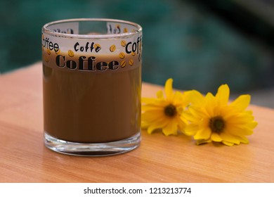 Transparent cup of coffee outdoors