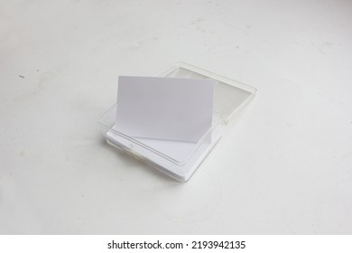 A Transparent Dirty Acrylic Box Of Blank Stack Name Card Is Isolated On White Background, For Brand Identity Business Card Mockup.