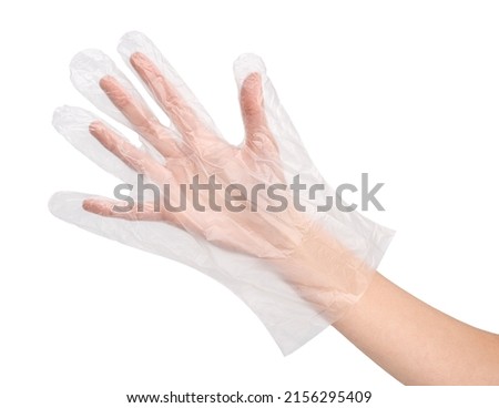 transparent disposable glove on women hand. hand palm dressed in new nice disposable plastic latex glove isolated on abstract white background. Wearing and special clothes concept. 