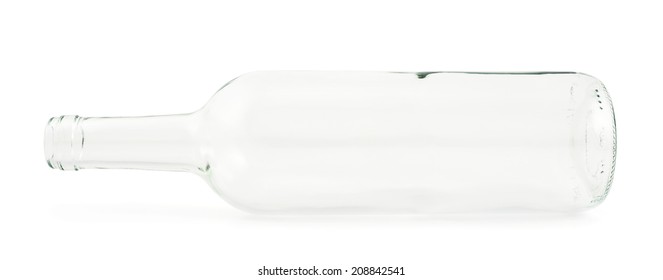 Transparent empty glass bottle lying on its side, isolated over white background