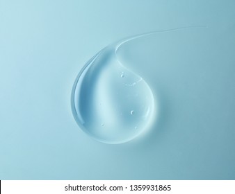 Transparent Gel Drop On Blue Background, Top View