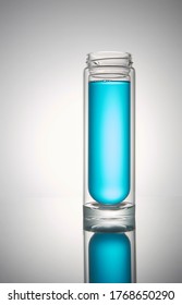 Transparent Glass Bottle Without Lid. With Blue Liquid.