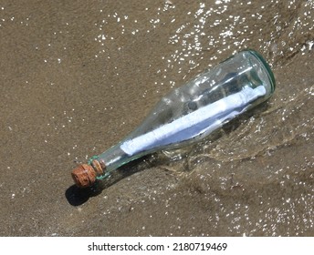 Transparent Glass Bottles With Cork Stoppers With A Secret Message Found On The Seashore Carried By The Waves