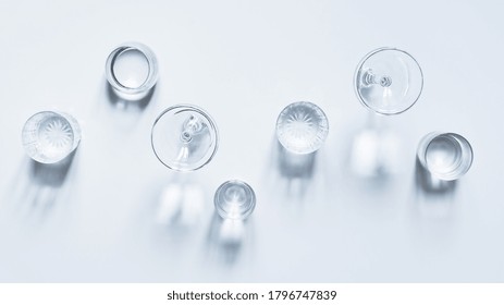 Transparent Glasses With Clear Water On White Background With Shadows Top View.  