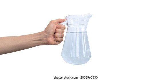 Transparent jar of water, carafe glass in hand isolated on a white background 