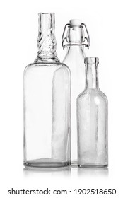 Transparent old antique bottles on a white background packshot