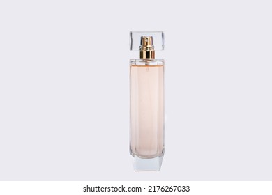 Transparent And Opaque Bottle Of Perfume With Label On A White Background. Feminine And Masculine Essence. Studio Light Concept.