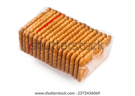 Transparent packaging of biscuits. A pack of cookies on a white background. Biscuits in cellophane packaging.