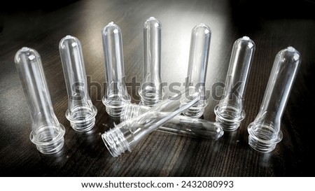 transparent PET preforms isolated on the table