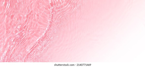Transparent pink clear water surface texture and ripples  splashes  Abstract summer banner background Water waves and copy space white gradient  top view Cosmetic moisturizer micellar toner emulsion