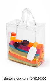 Transparent Plastic Bag With Beach Accessories, Isolated On White.