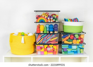 Transparent plastic containers with various children's toys on shelves. Organizing and Storage Ideas in nursery. Space organizing at childrens room. Toys sorting system. - Shutterstock ID 2221899531