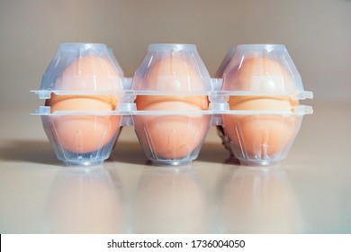 Transparent plastic egg box. Front view of the object