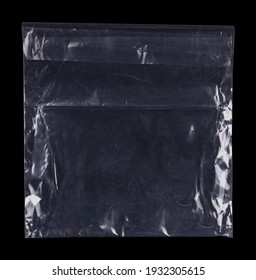 Transparent plastic wrap on the black background. Clean blank texture overlay effect template. Isolated wrinkle surface branding mock-up. Black pack packaging bag.