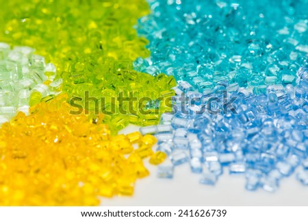 transparent polymer pellets in lab on white table