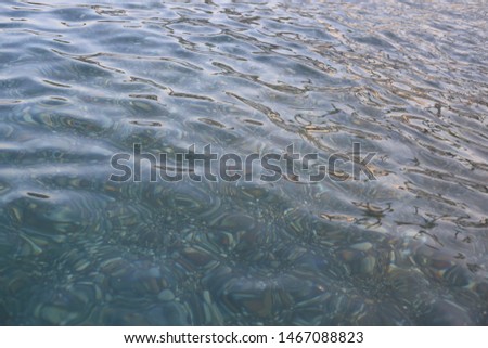 Transparent sea water with reflection of the sun. Mediterranean Sea. Can be used for background and design.