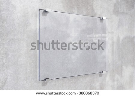 Transparent signboard on concrete wall, mock up