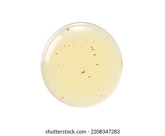 Transparent skin care liquid texture. Yellow serum and bubbles on white background.