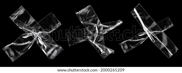 transparent sticky tapes forming the letter x\
or overlapping each other on black background, crumpled plastic\
snips, poster design\
overlays.