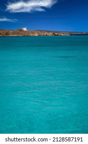 Transparent turquoise waters in Kolybithres and a little chapel, in Naousa’s bay, Paros island, Cyclades, Greece
