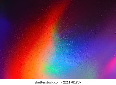 Transparent water drops on multicolored abstract background. Imitation of space in the studio in a futuristic style. Simple poster background