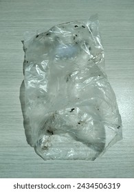 transparent white plastic waste with dirty brown spots 