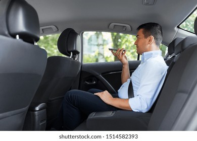 Transport, Business And Technology Concept - Male Passenger Or Businessman Using Voice Command Recorder On Smartphone On Back Seat Of Taxi Car