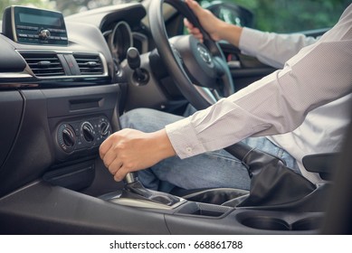 transport, business trip, destination and people concept - close up of young man driving car - Shutterstock ID 668861788