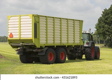 Transport Of Cut Grass With Tractor And Loader Wagon