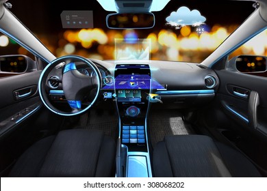 Transport, Destination And Modern Technology Concept - Car Salon With Navigation System On Dashboard And Meteo Sensor On Windshield Over Night Lights Background 