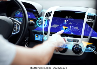 Transport, Destination, Modern Technology And People Concept - Male Hand Searching For Route Using Navigation System On Car Dashboard Screen