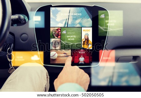 transport, driving, technology, media and people concept - close up of male hand using virtual internet applications on car computer screen