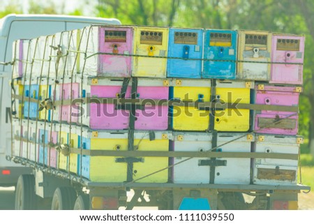 Transport of hives. House of bees. Cargo transportation by trailer along the route