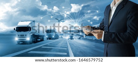 Transport and logistic concept, Freight shipping online, Businessman using tablet and data for global logistic network distribution on world map background, Business and technology, Blue tone.