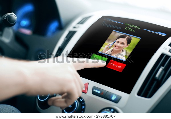 transport, modern technology, communication and\
people concept - male hand pushing button and receiving video call\
from woman on car panel\
screen