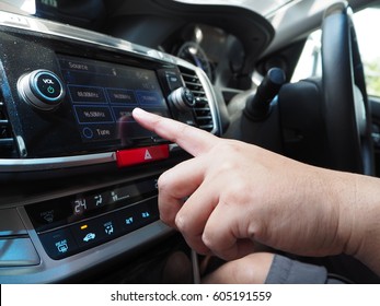 Transport, Modern And Technology Concept: Male Touching On Car Control Panel To Use Audio Player